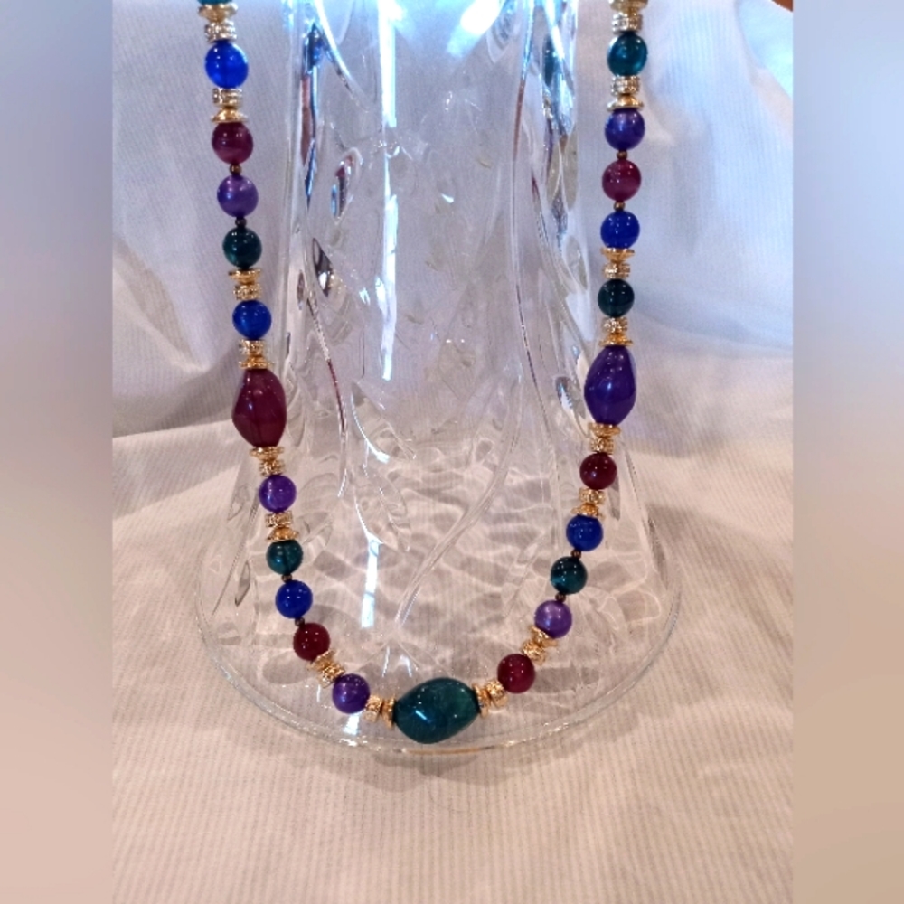 Beaded necklace purple, green, blue,and gold toned size 24 inches long